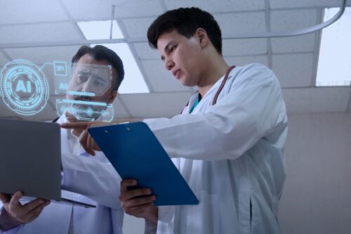 Two scientists in white coats review data on a futuristic holographic AI interface and a clipboarded document in a lab setting.