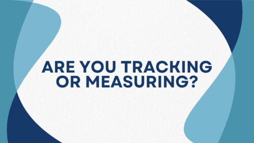 Banner graphic with bold navy text: 'ARE YOU TRACKING OR MEASURING?' on a white textured center framed by blue abstract shapes around the edges.